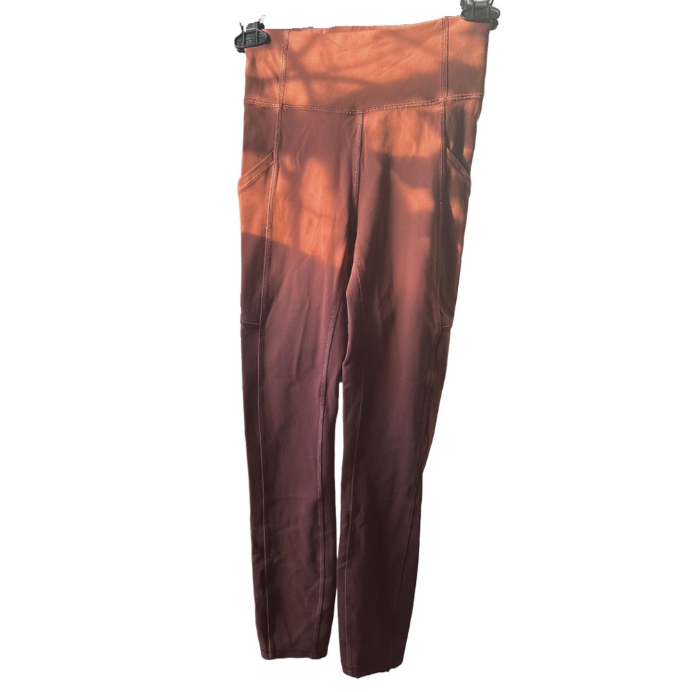 Lululemon women’s sz 2 Burnt Orange Leggings(solid color sorry for the sunlight)